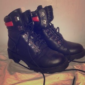 Black leather lace up boots.